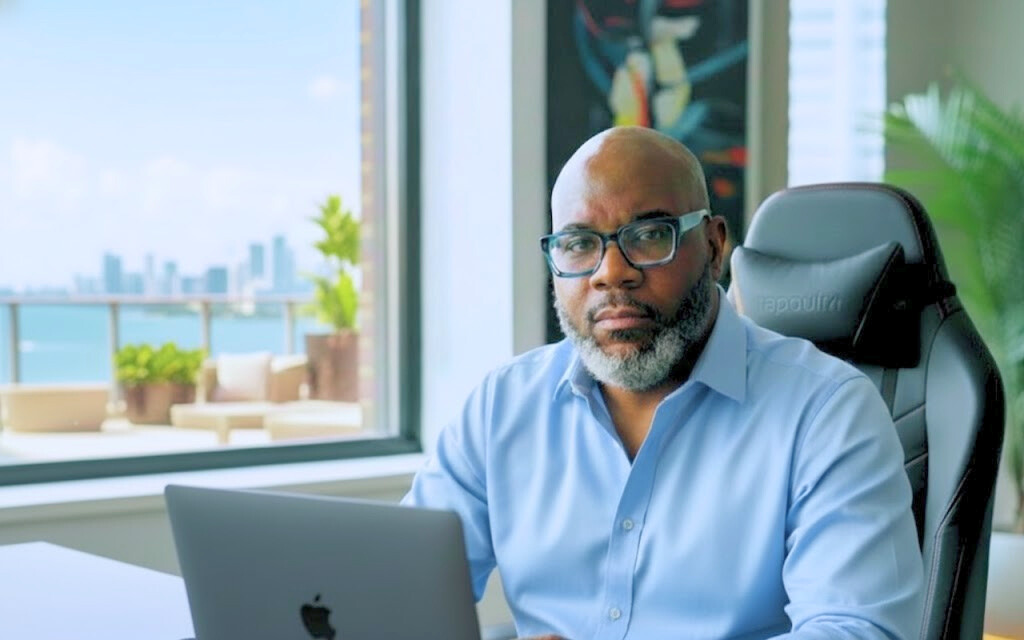 Derek Bingham working with a skyline in the background